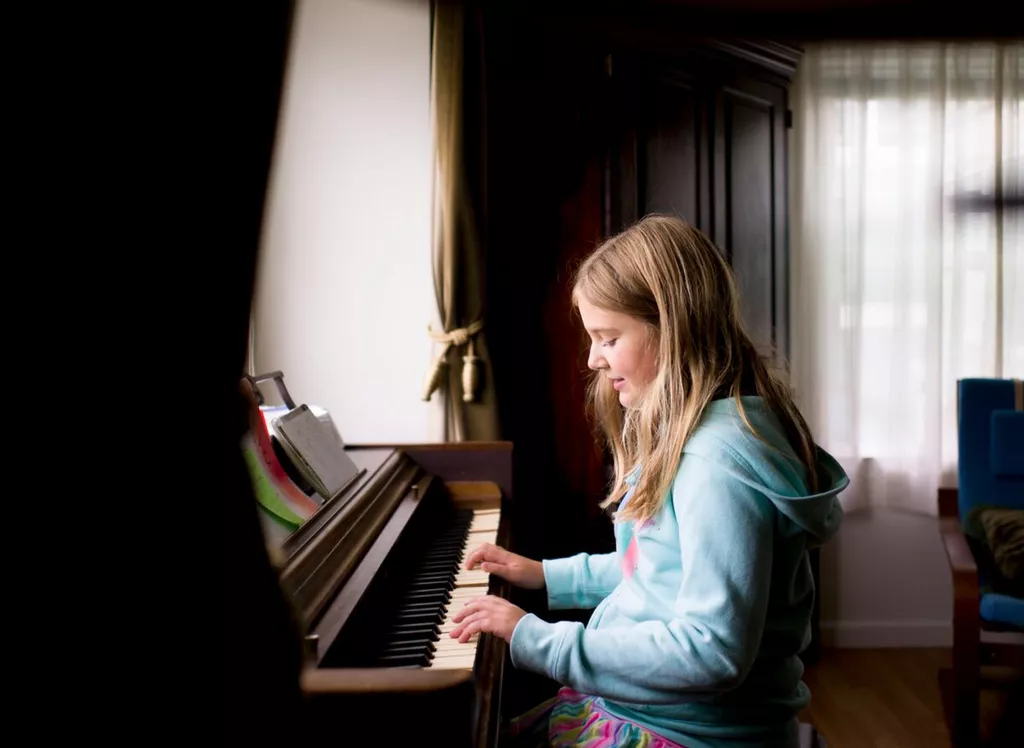 girl playing piano