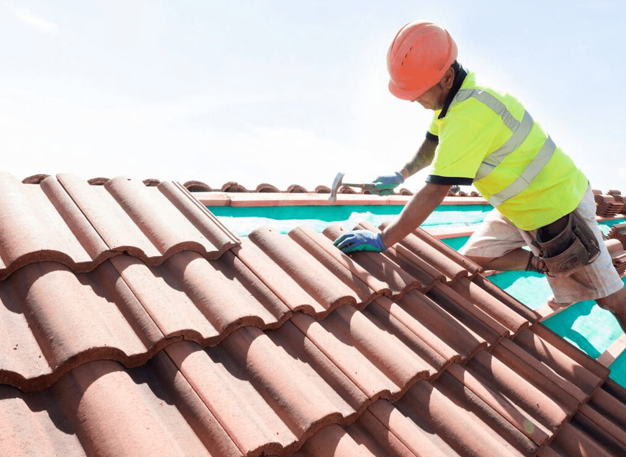 roofer hammering on roof