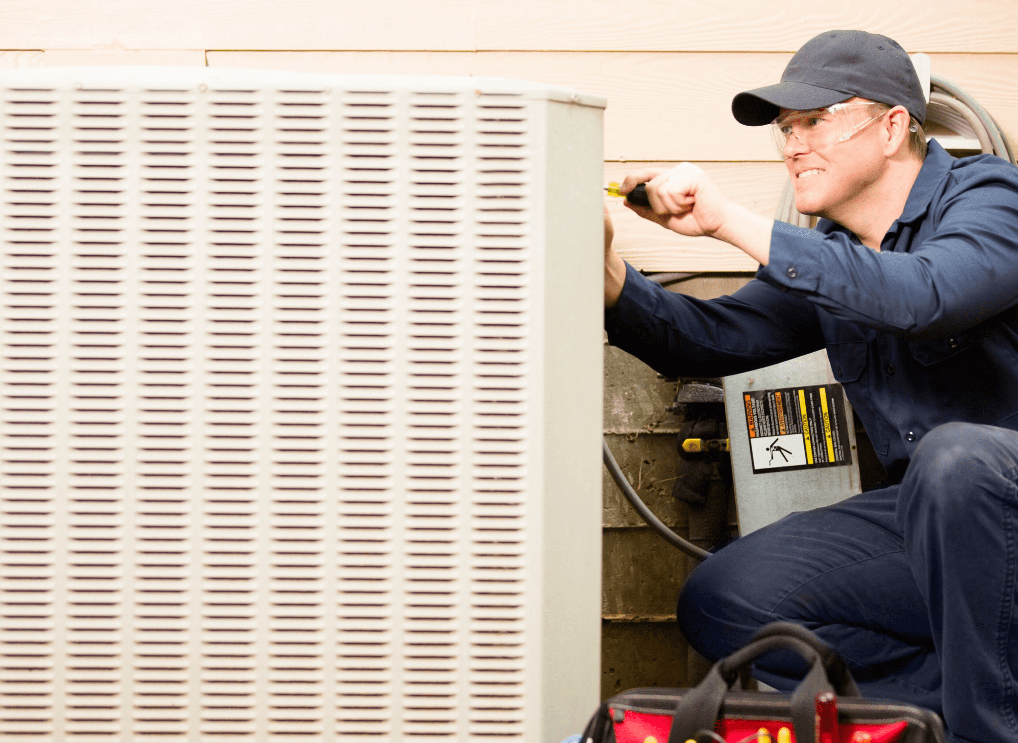 HVAC specialist repairing outside unit