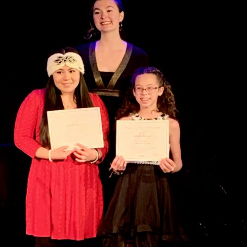 Students and their awards after a recital