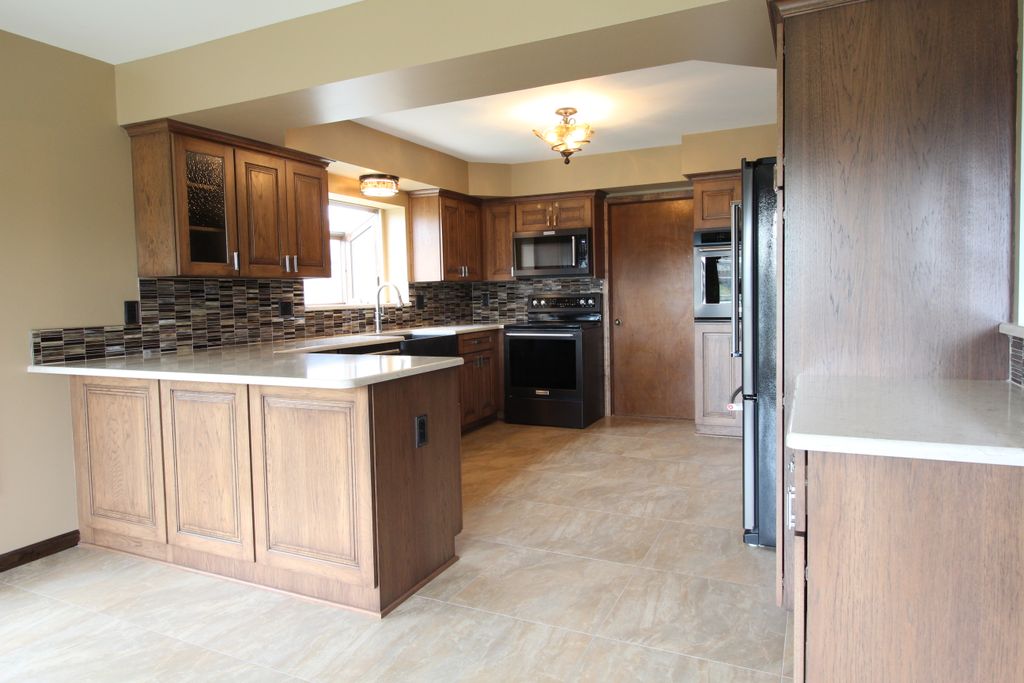 Kitchen with custom cabinetry in hickory.