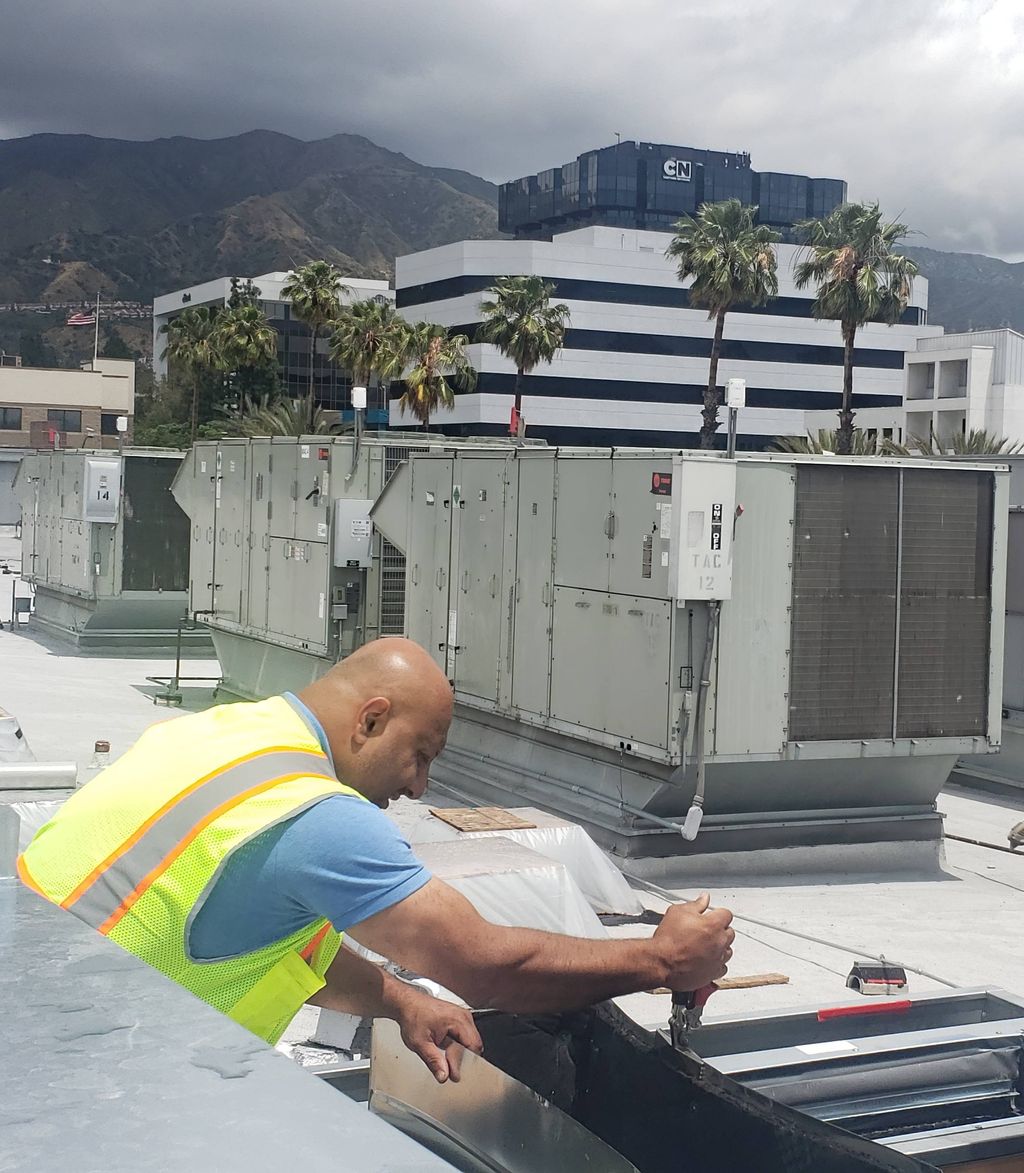 preparing curb on Burbank mall Center Roof 