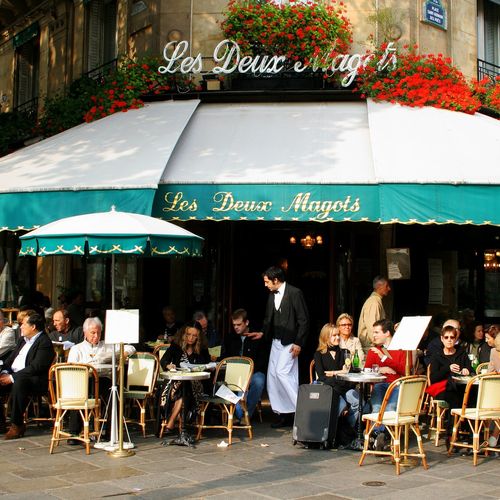 People watching at Les Deux Magots café in the Sai