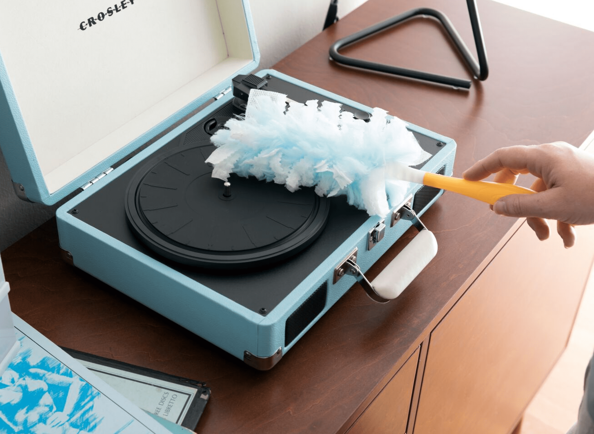 dusting a record player