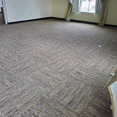 living room carpet tile installatio. and wall base