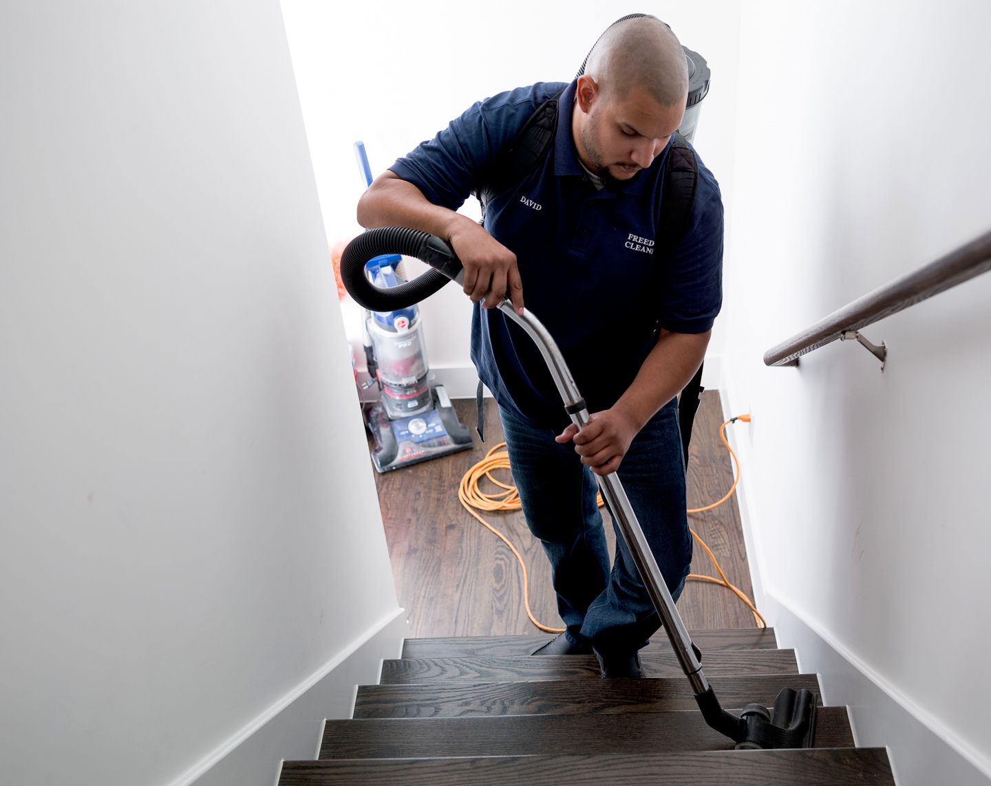 man steam cleaning stairs