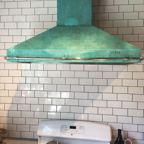 Installed tile backsplash and range hood in my kit