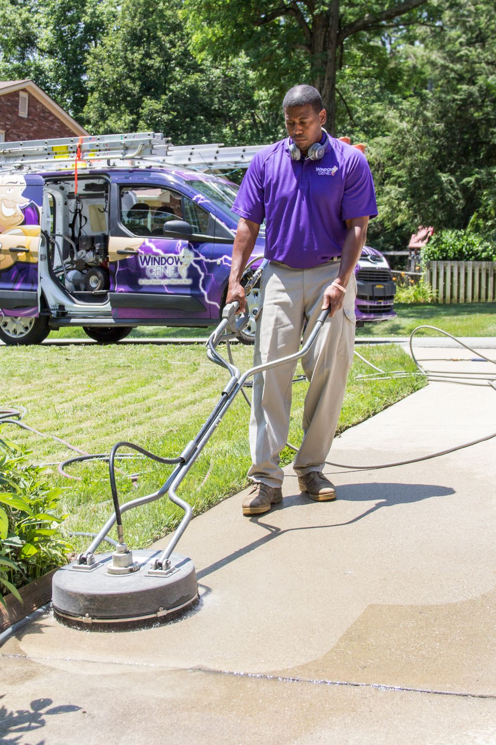our crew flat surface cleaning a driveway