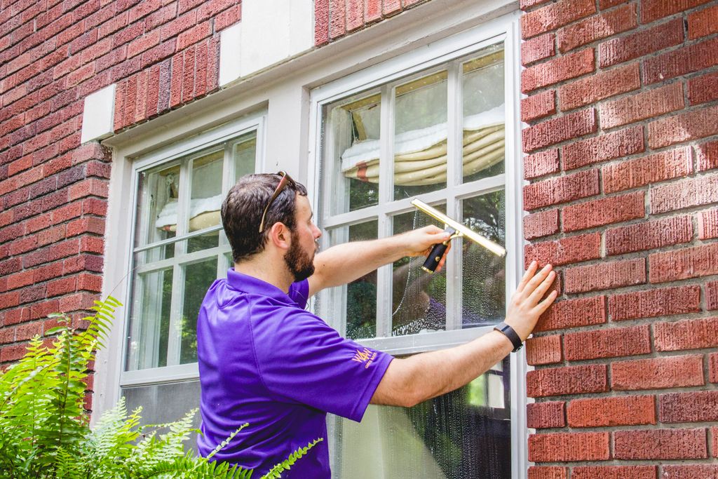 window cleaning using a mop and squeegee