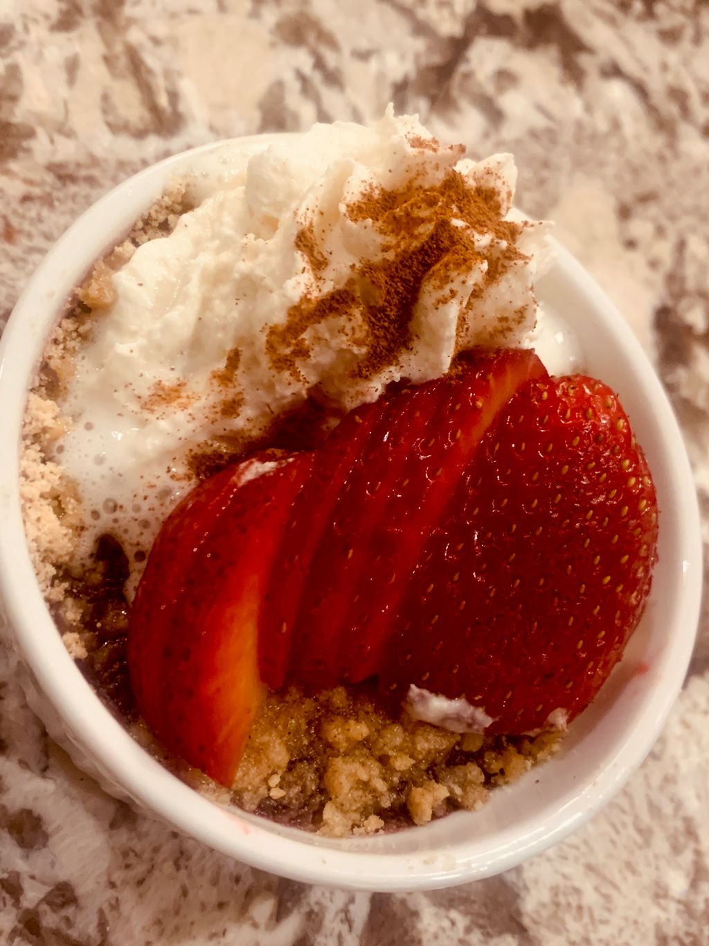 Mixed berry cobbler with fresh whipped cream and f