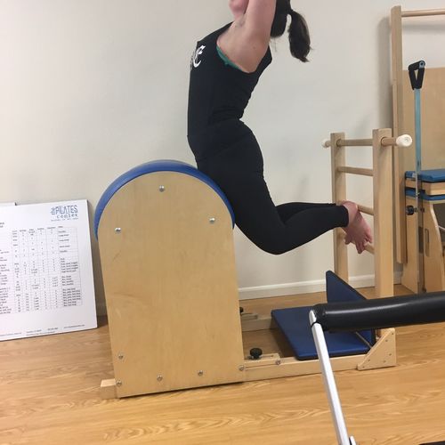 The Swan exercise on the Pilates Ladder Barrel, a 