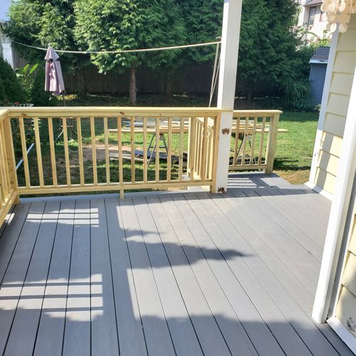Composite decking with wooden handrails. 