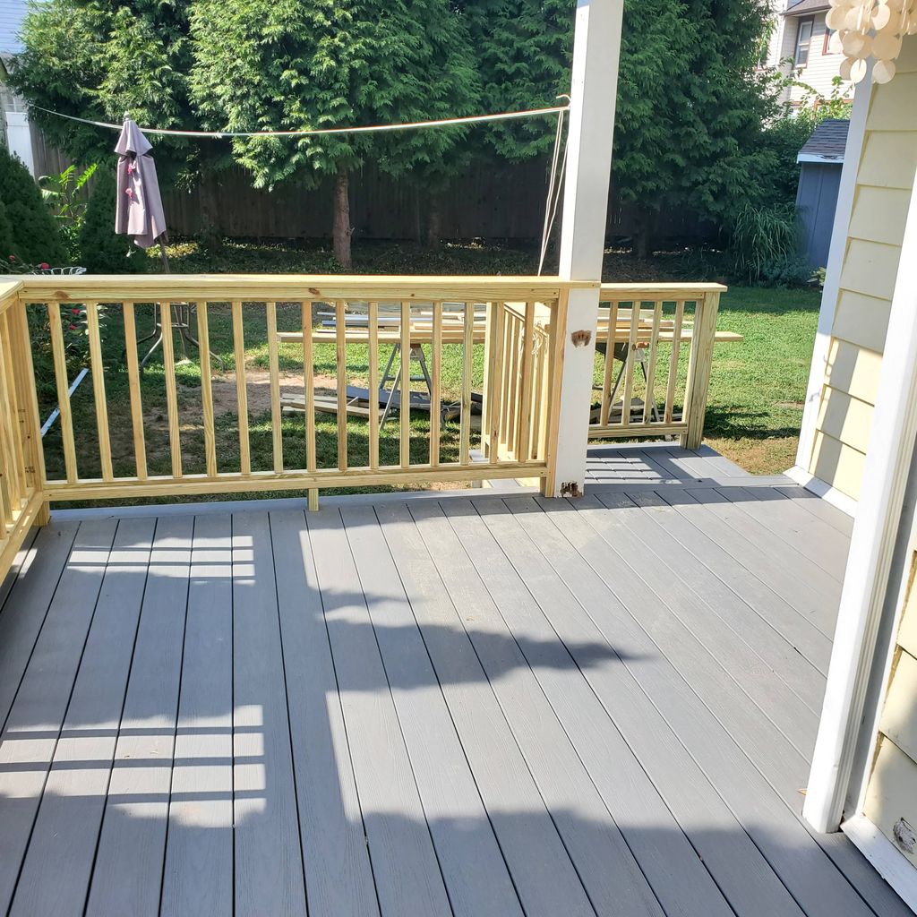 Composite decking with wooden handrails. 