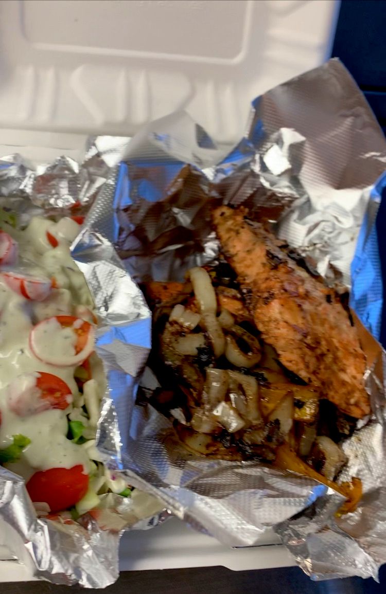 Grilled salmon with a fresh toss salad topped with