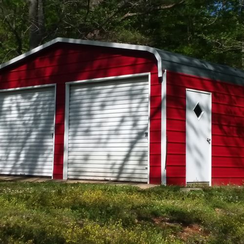 A nasty old garage painted to look like a barn! 