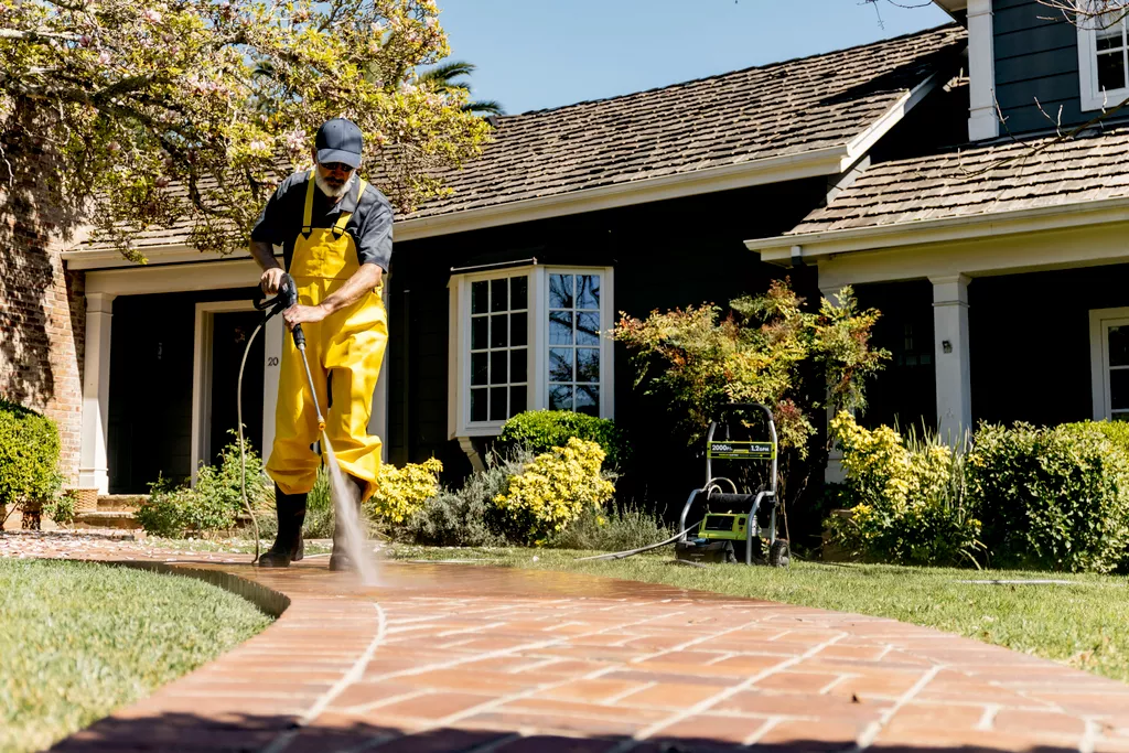 pressure washing walkway outside home