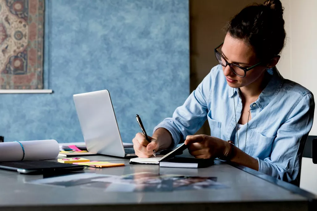 woman writing in notebook