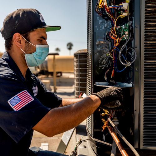 Our technician installing an HVAC unit