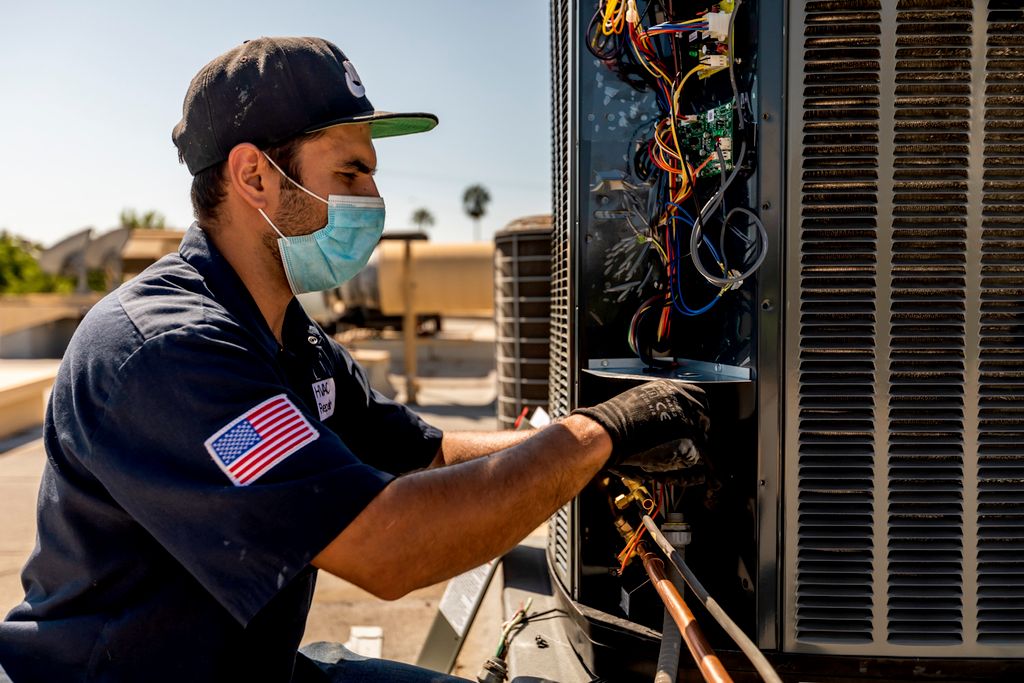 Our technician installing an HVAC unit