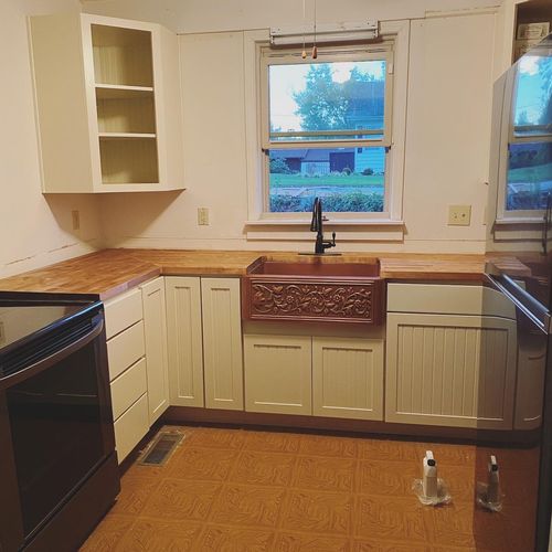 Charles installed new kitchen cabinets, counter, a
