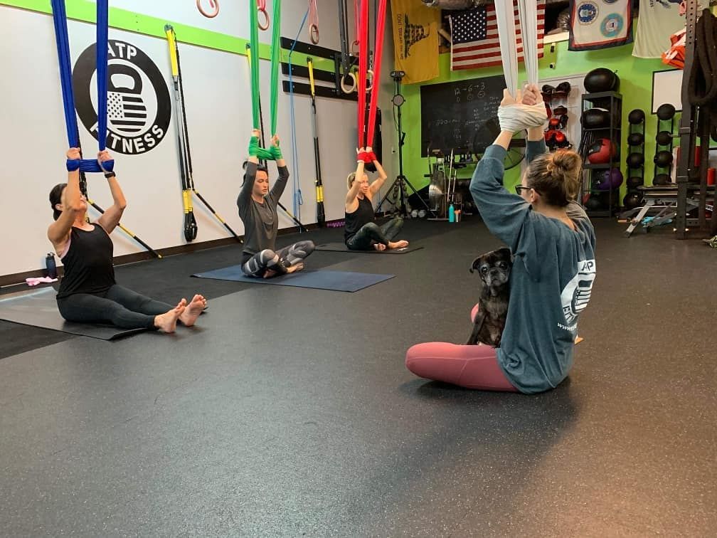 Aerial yoga before covid-19, featuring Instructor 