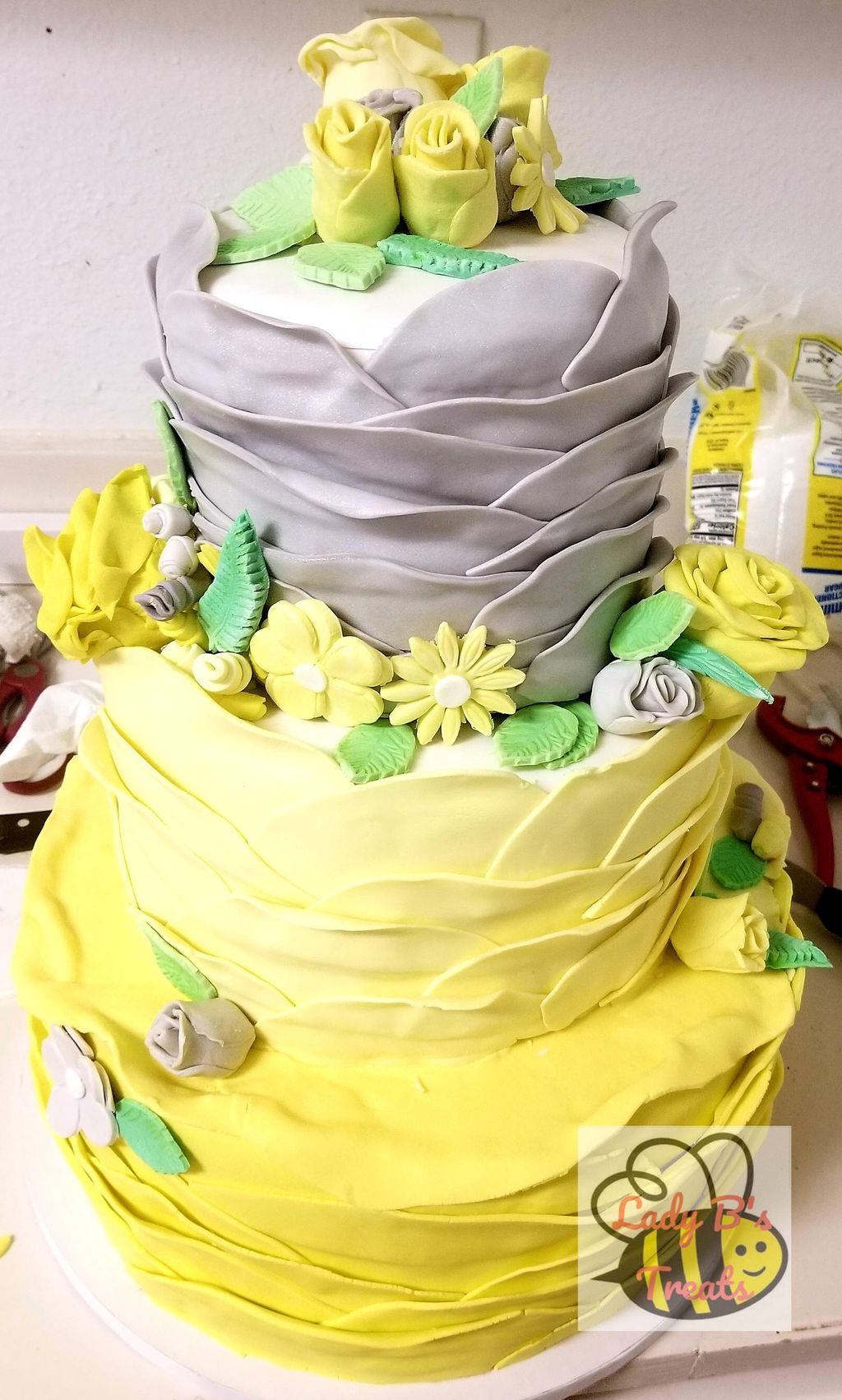 yellow and gray ruffled wedding cake!