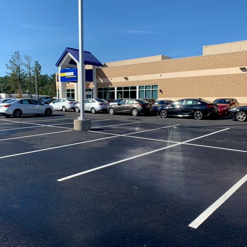 Stain removal on asphalt parking lot. 