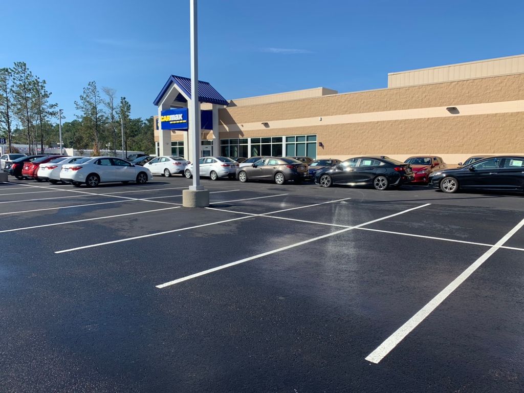 Stain removal on asphalt parking lot. 