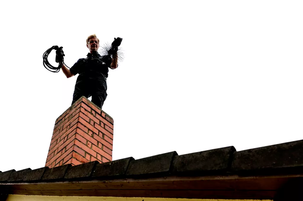 chimney sweep on roof