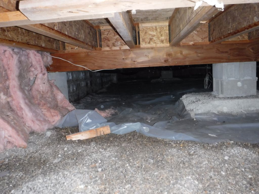 Before picture of a moldy crawlspace that was lack