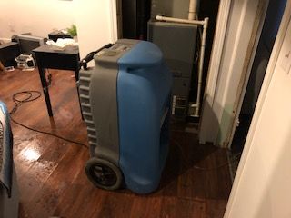 A dehumidifier running at a water loss. 