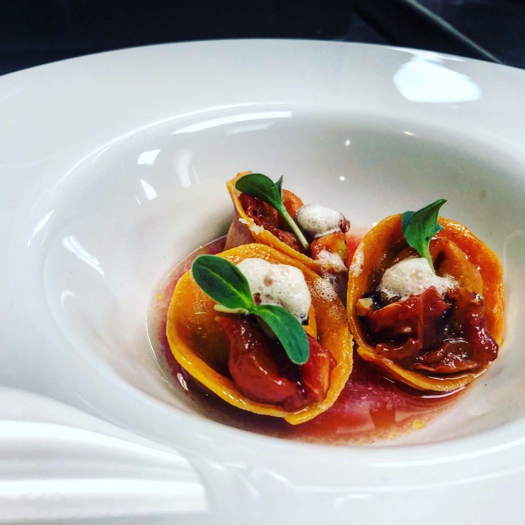 Herb RicottaTortalini, Tomato water, Parmesan foam