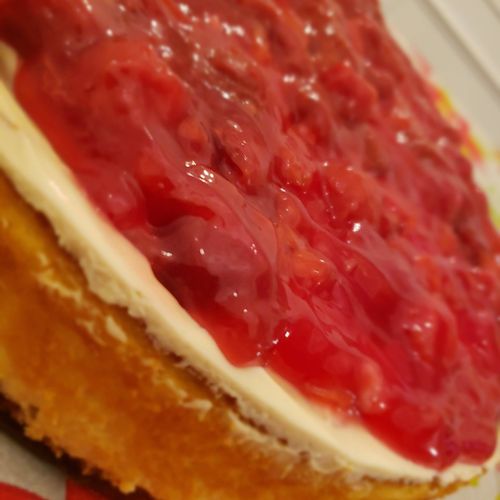 NY cheesecake with sour cream and cherry topping