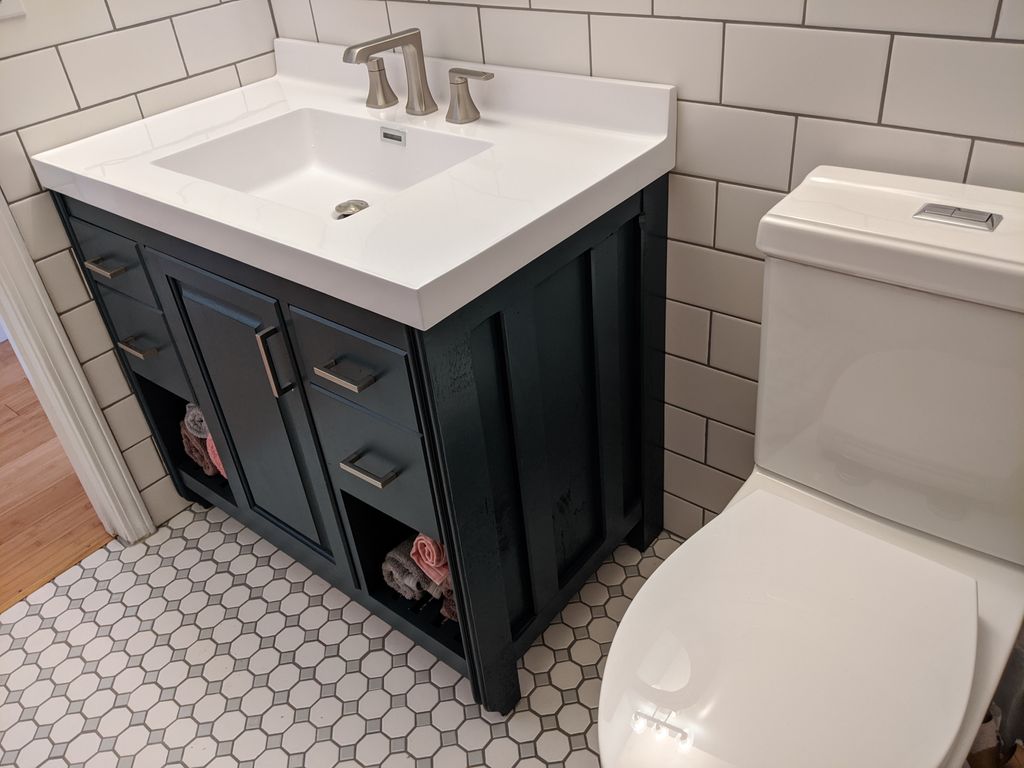 Finished bathroom with custom vanity