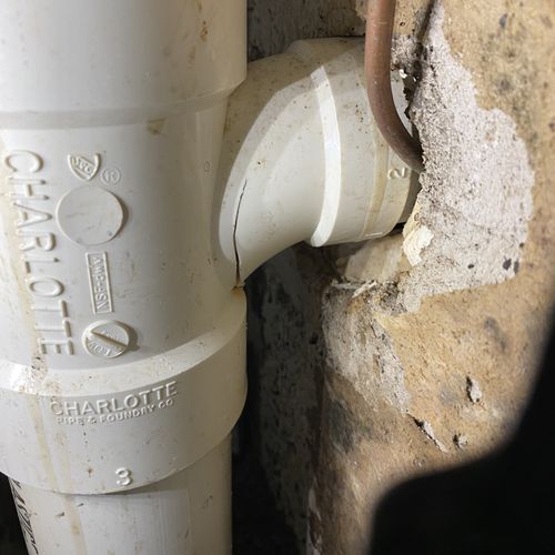 drain leak from broken PVC fitting 