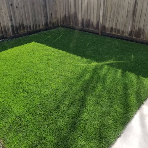 David laid artificial turf in the backyard of our 