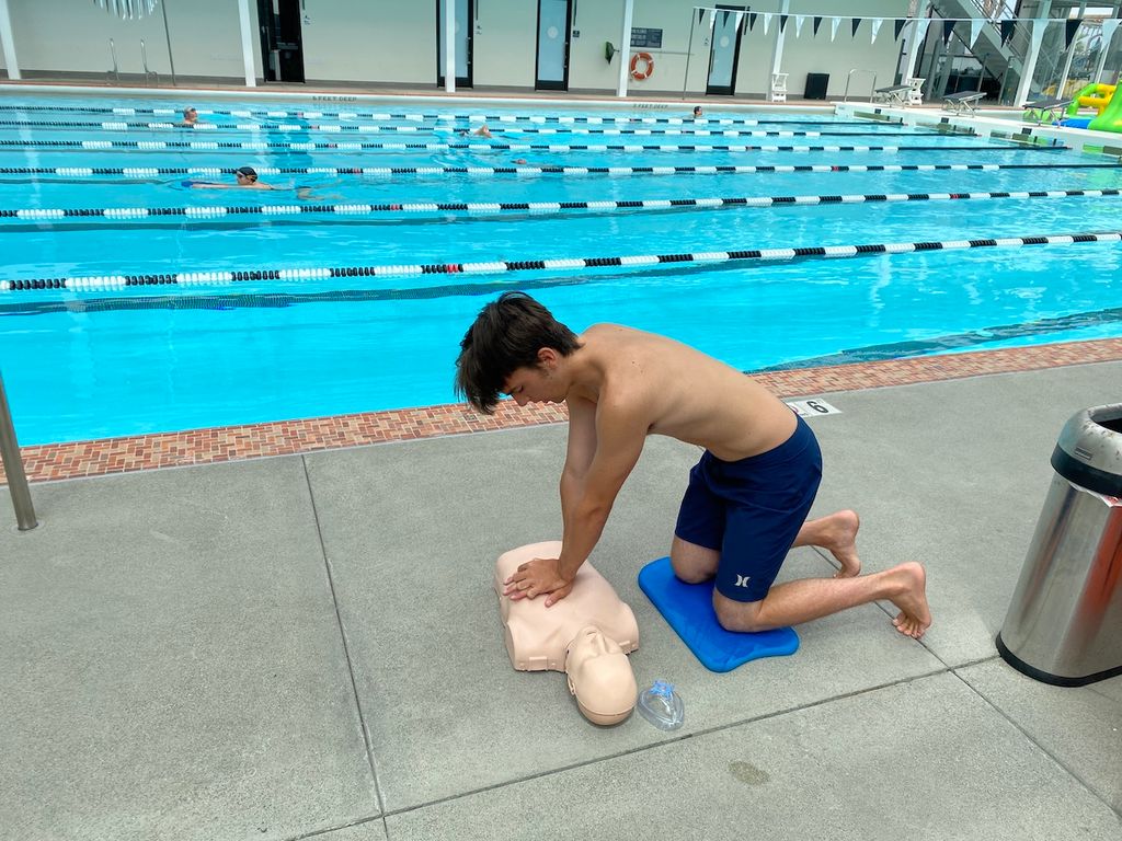 Lifeguard Certification Class, Practicing CPR. 