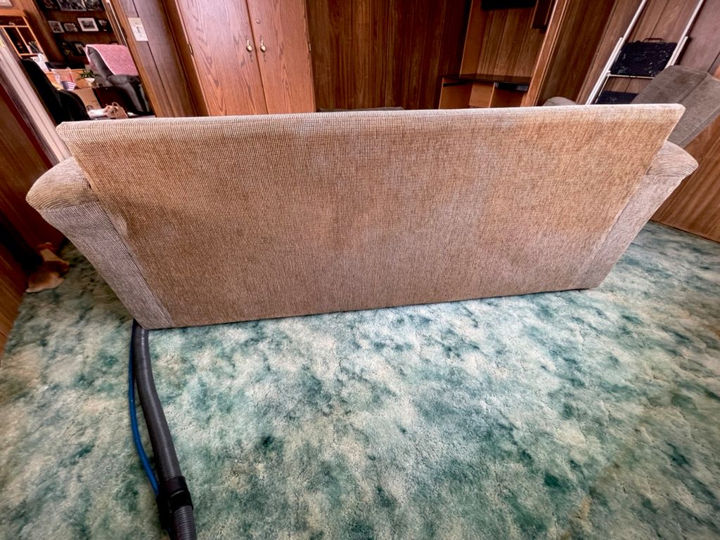 Smoke stained couch from years of cigarette smoke 