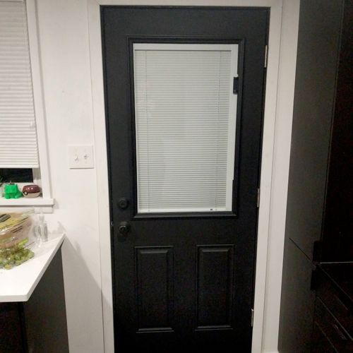 Bought, painted and installed two exterior doors f