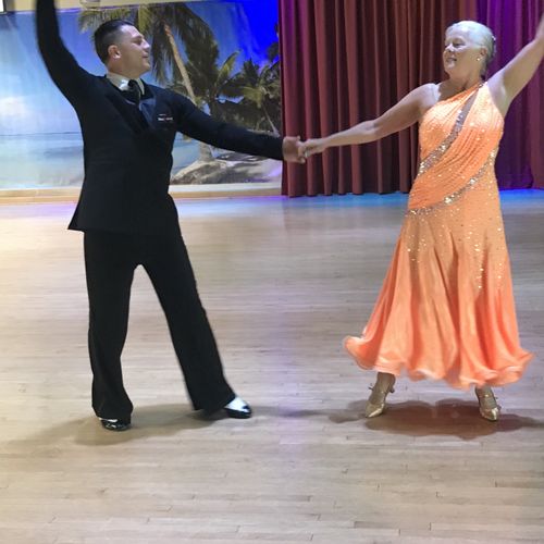Dancing at the local showcase with my student Amy