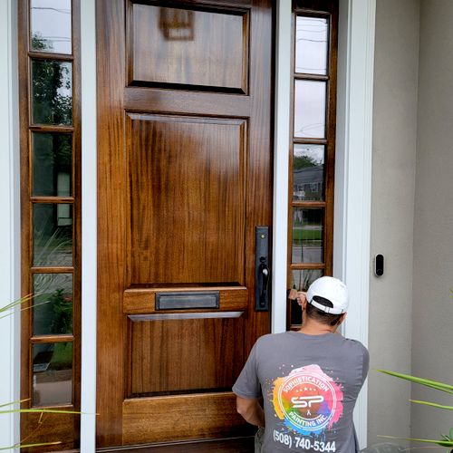 front door stained and finished with top coat 