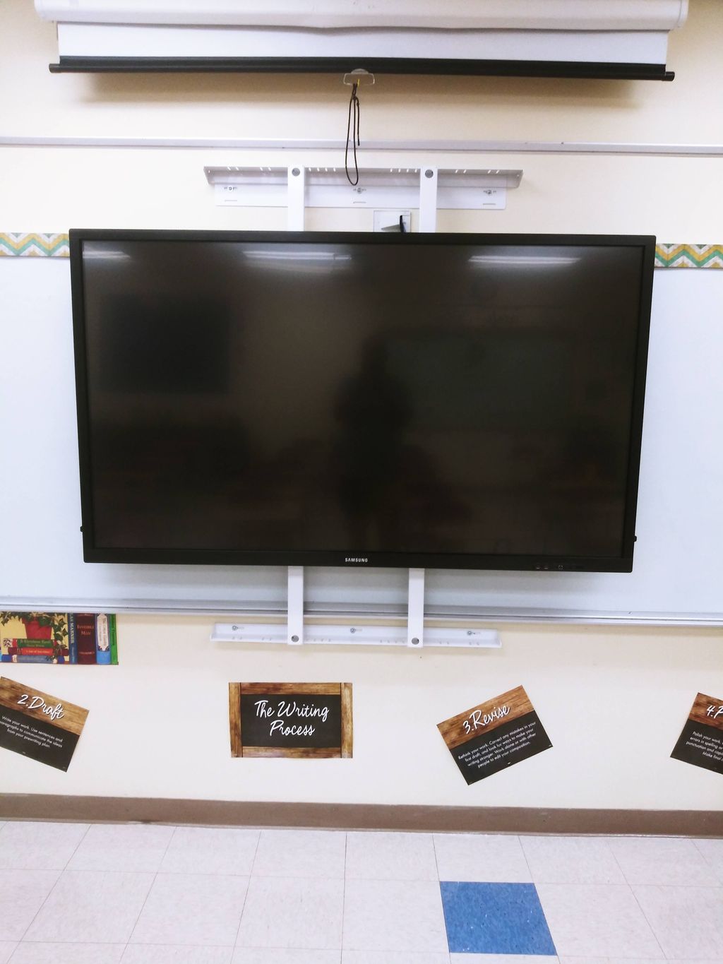 75" Tv installed over whiteboard in Middle school 