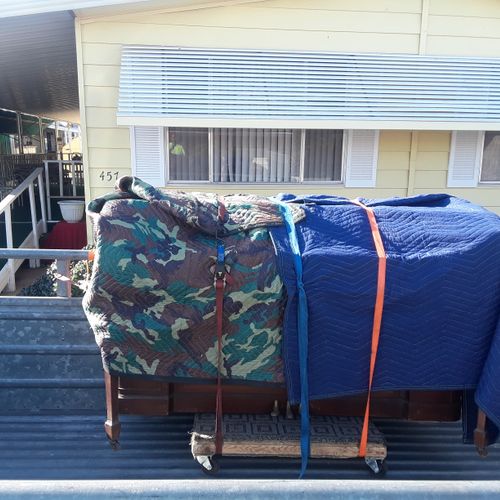 upright piano transport-covered and strapped