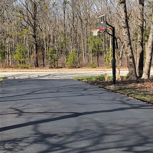 Andy installed a basketball hoop in my driveway. W