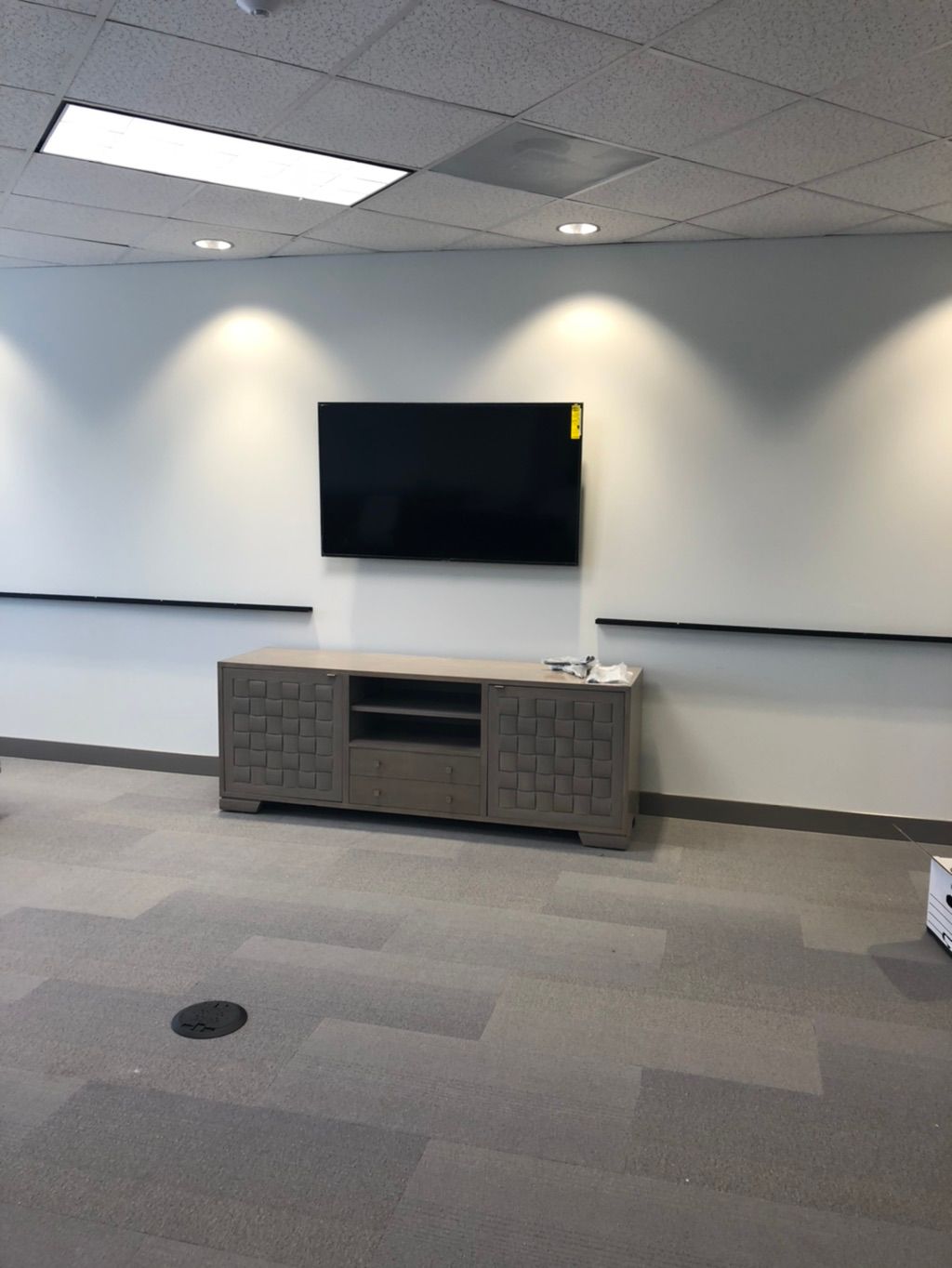 Conference room display install with border shelvi