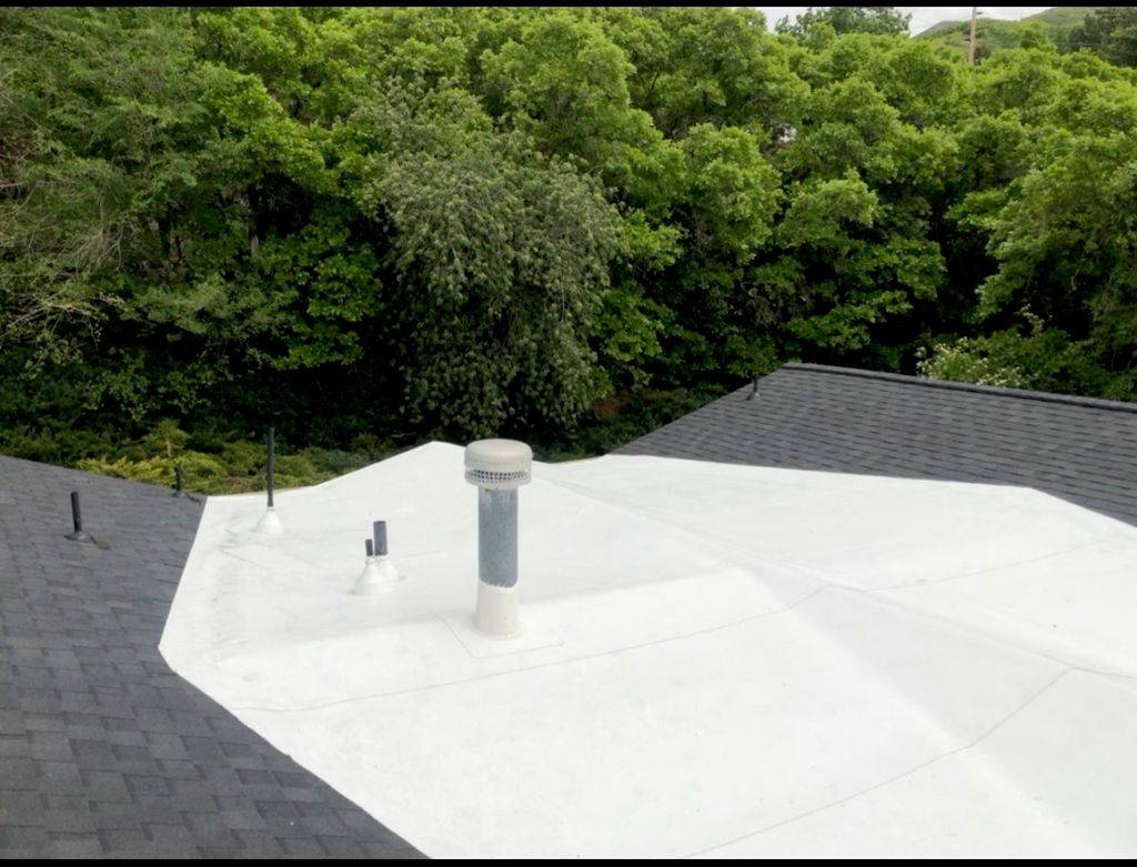 Bountiful roof with shingles and TPO membrane.