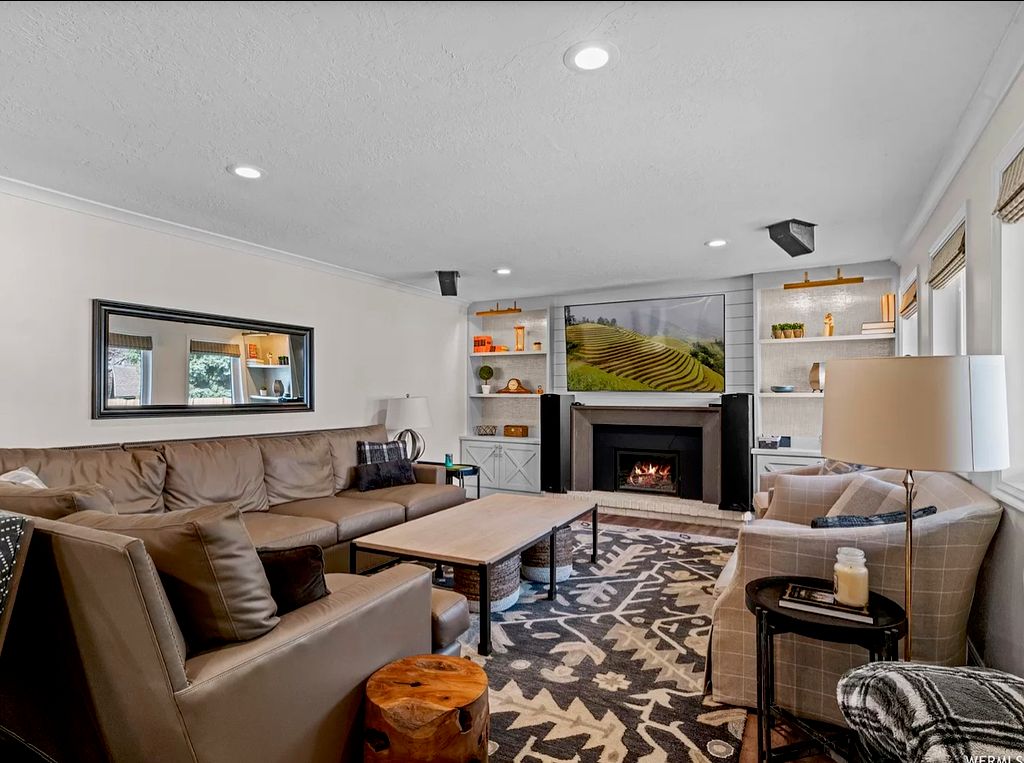 Remodeled family room with built in shelves and sh