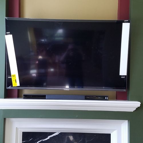 Mr. G installed a 65" TV over our fireplace. He as