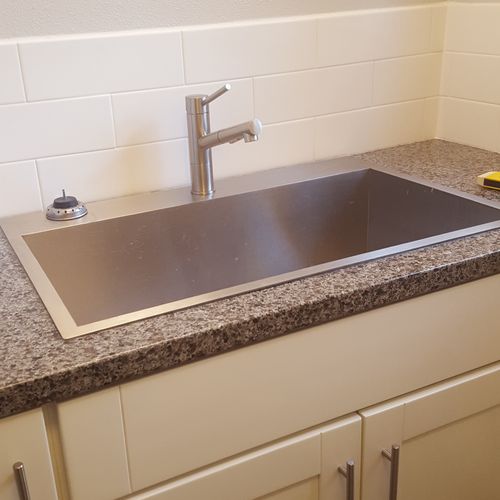 new counter, sink faucet and backsplash