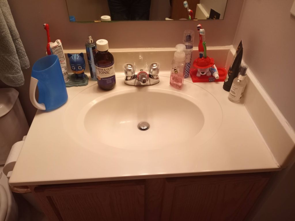 This kids bathroom sink had toothpaste everywhere.
